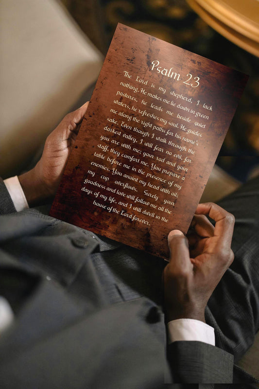 Man holding a Psalm 23 burnished bronzed Metal plaque. Photo courtesy of Honeycomb Proverbs