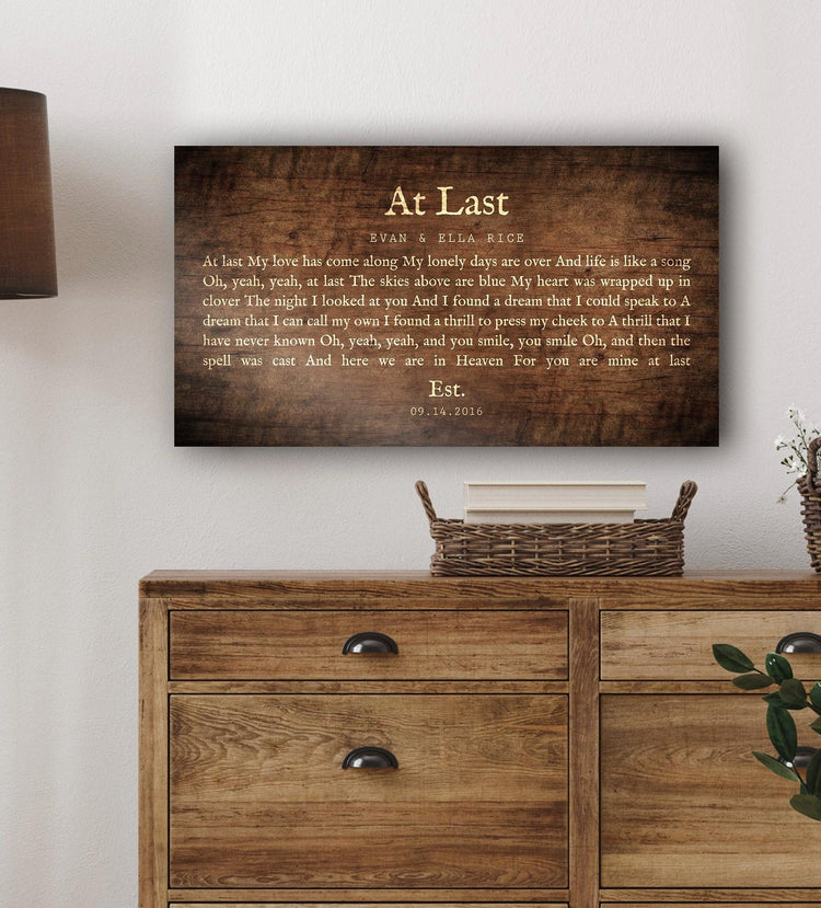 At Last song lyric sign on dark wood above a rustic dresser