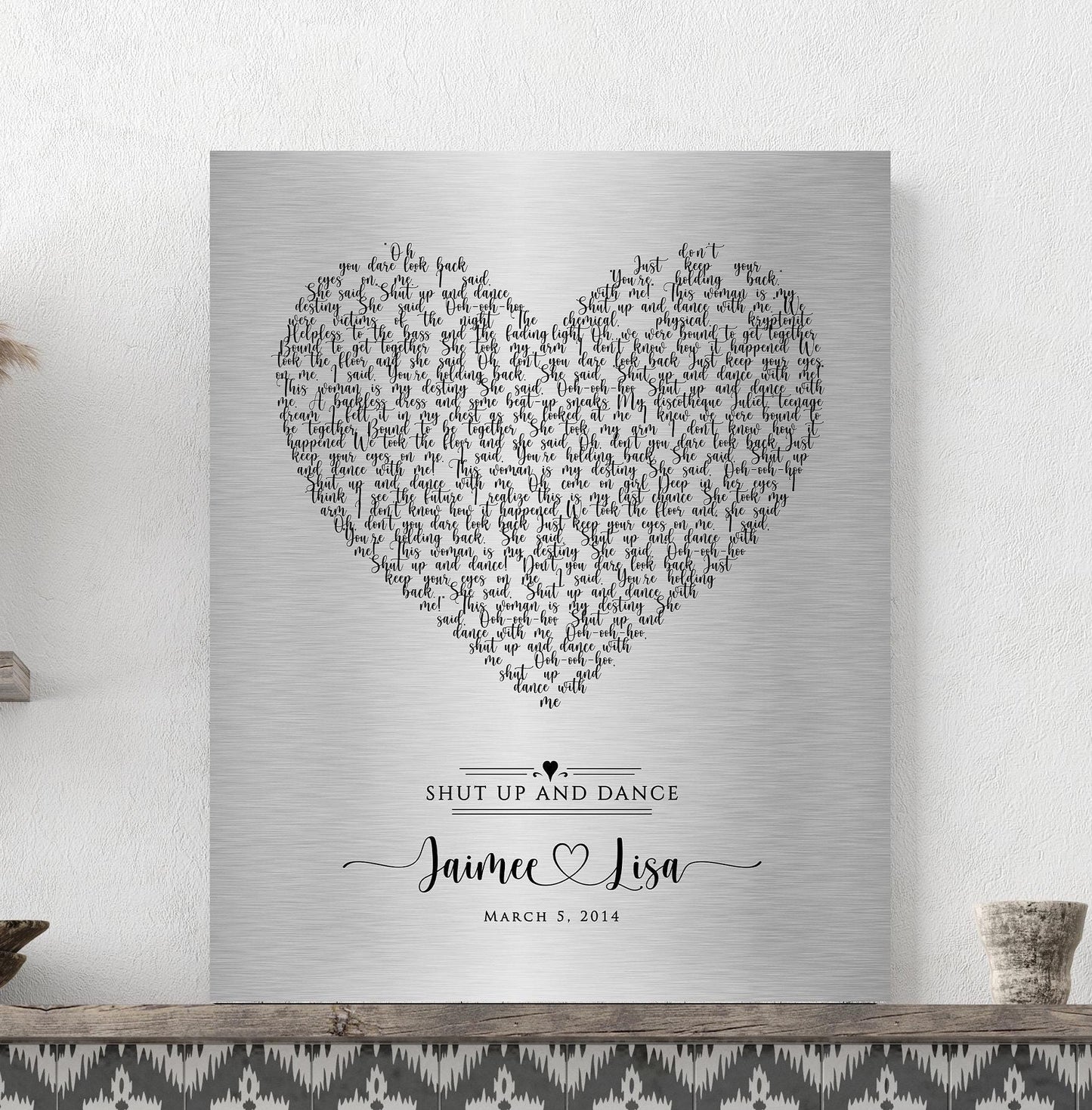 tin metal 1st dance sign with song lyrics for anniverTin Anniversary Heart Song Lyrics Plaque
Celebrate your love with a stunning tin-alloy keepsake, featuring your special song arranged in a heart motif. Designed with whimsical calligraphy, this unique piece showcases the couple’s names connected by a heart beneath the lyrics.sary