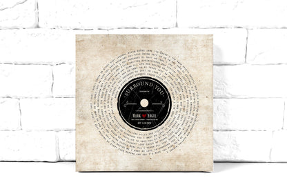 Song lyrics on canvas in a vinyl record design around a retro label with a couple's first names, 2nd anniversary cotton