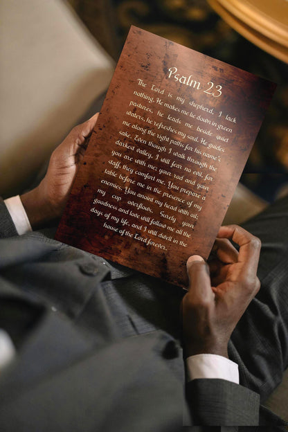 Man holding a Psalm 23 burnished bronzed Metal plaque.  Photo courtesy of Honeycomb Proverbs