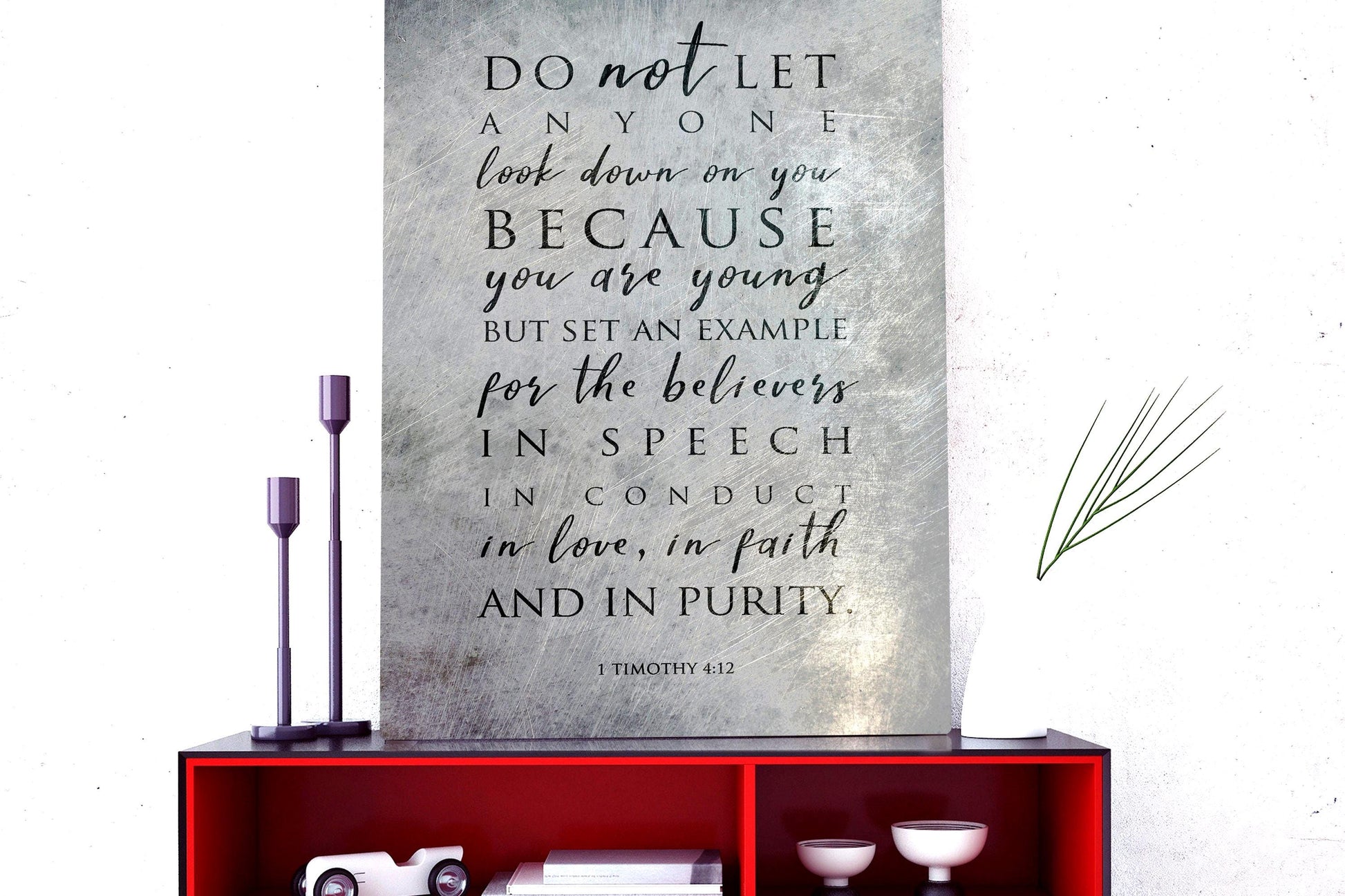 Metal Distressed Christian Wall Art with a black inspirational quote: "DO not LET ANYONE look down on you BECAUSE you are young BUT SET AN EXAMPLE for the believers IN SPEECH IN CONDUCT in love, in faith AND IN PURITY." The quote is attributed to 1 Timothy 4:12.

Photo courtesy of Honeycomb Proverbs