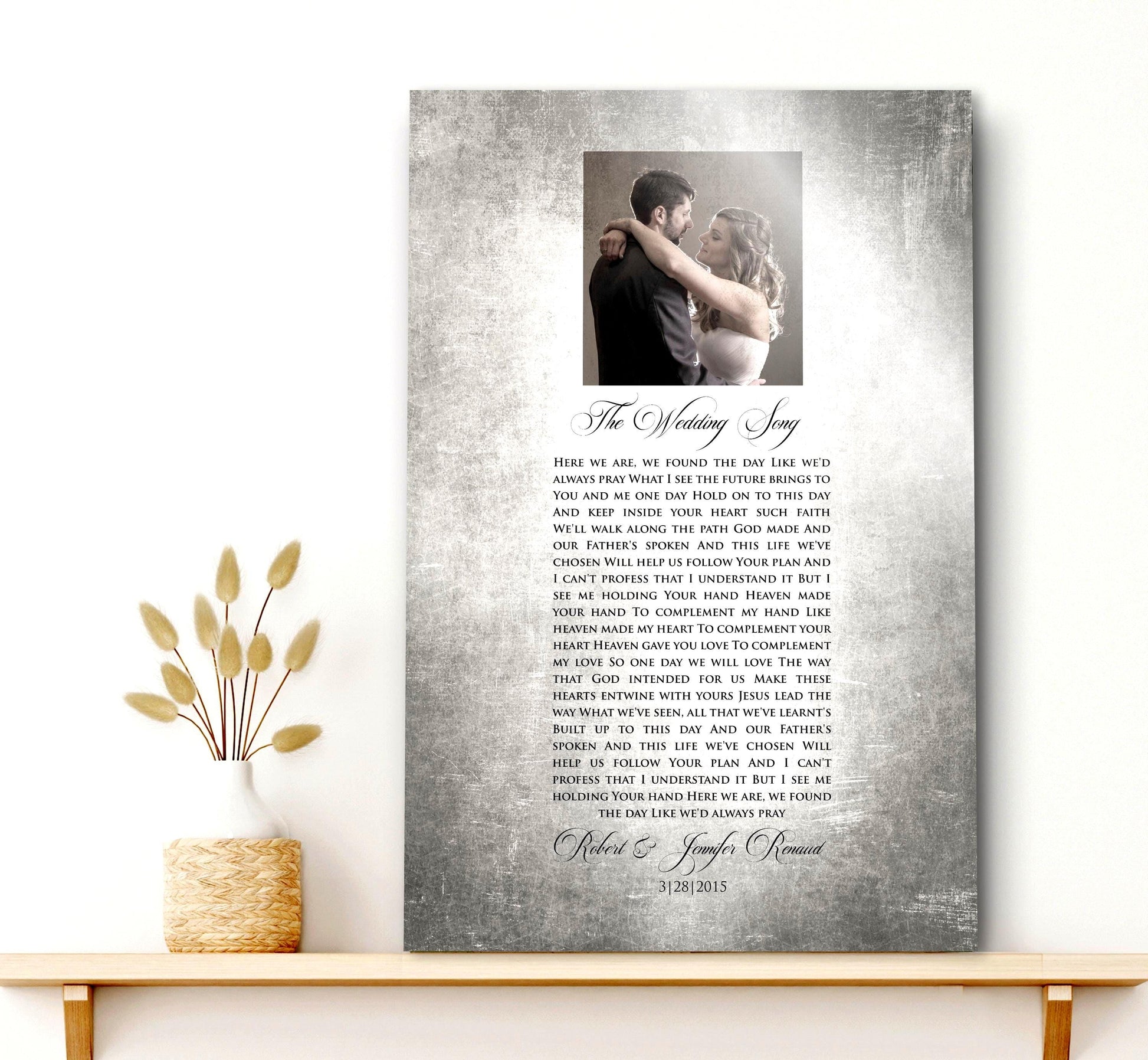 Custom Portrait plaque on tin for couples. Features the song lyrics or wording of choice and a photo cameo above the lyrics. This piece is handcrafted on vintage tin and is displayed on a single shelf with a rustic vase on the shelf to the left.

Courtesy of Honeycomb Proverbs