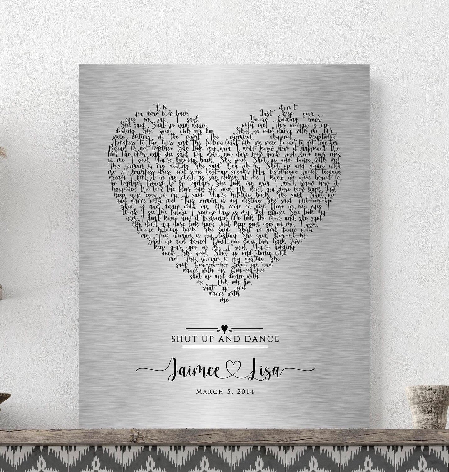 tin metal 1st dance sign with song lyrics for anniverTin Anniversary Heart Song Lyrics Plaque Celebrate your love with a stunning tin-alloy keepsake, featuring your special song arranged in a heart motif. Designed with whimsical calligraphy, this unique piece showcases the couple’s names connected by a heart beneath the lyrics.sary