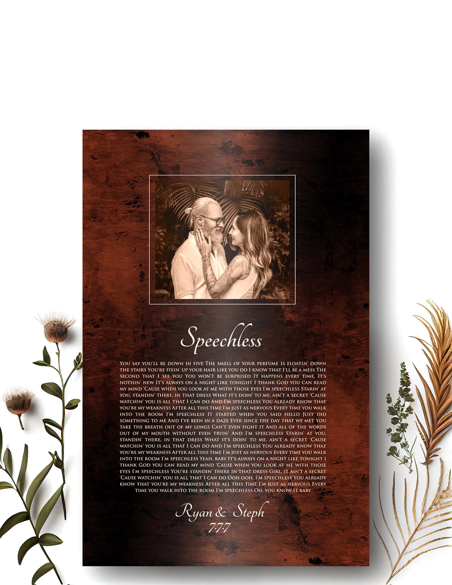 Bronze anniversary song plaque with photo of bride and groom framed at the top of plaque and song lyrics to Speechless beneath, followed by their names and wedding date.