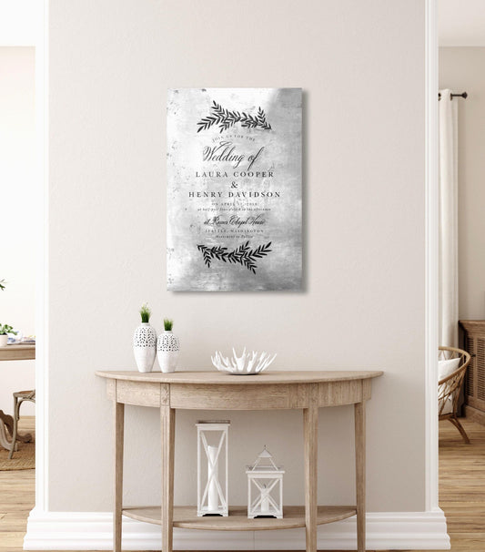 Tin Anniversary Invitation Plaque is created by transferring a wedding invitation on tin. The featured artwork is created on a tarnished tin and hangs on a wall above a table.