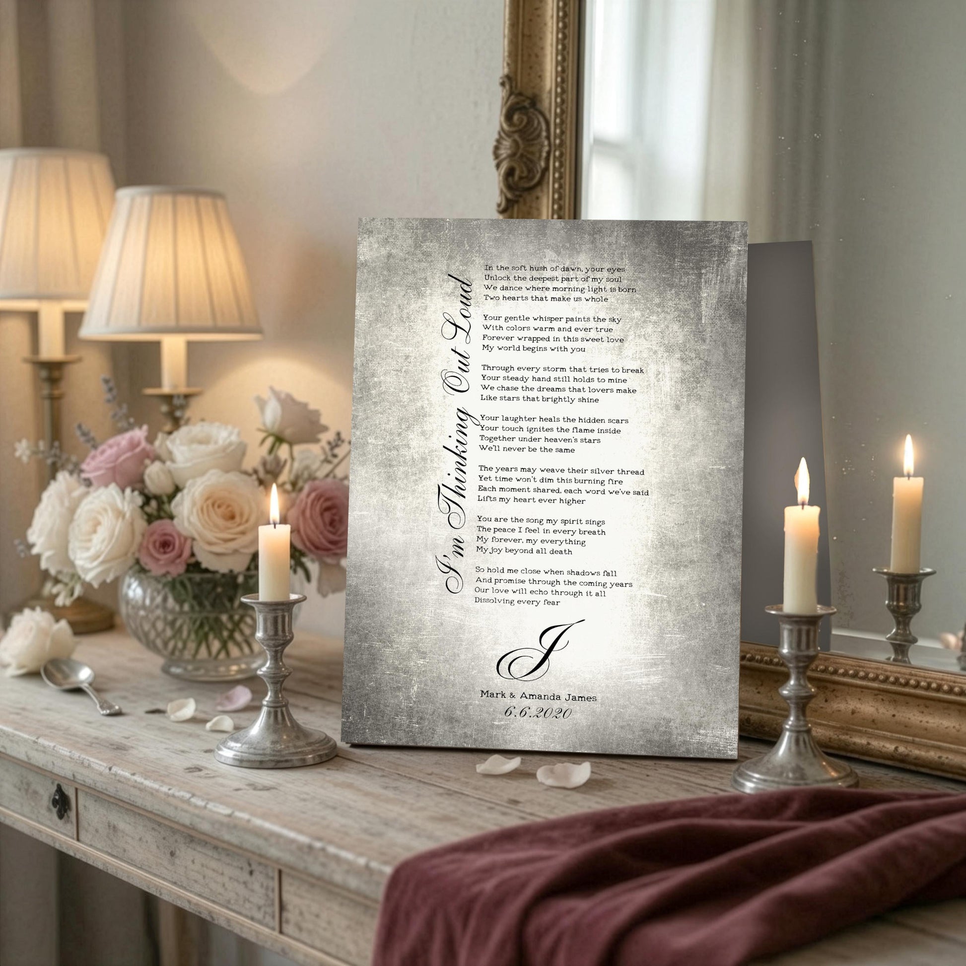 Custom metal plaque with personalized song lyrics, a monogram letter, and the names of a married couple celebrating a ten year anniversary. The plaque is displayed on a table next to a candle-flame.