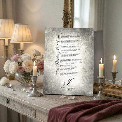 Tin song lyric plaque with monogram and a couple's names for their 10th anniversary, displayed beside a candle