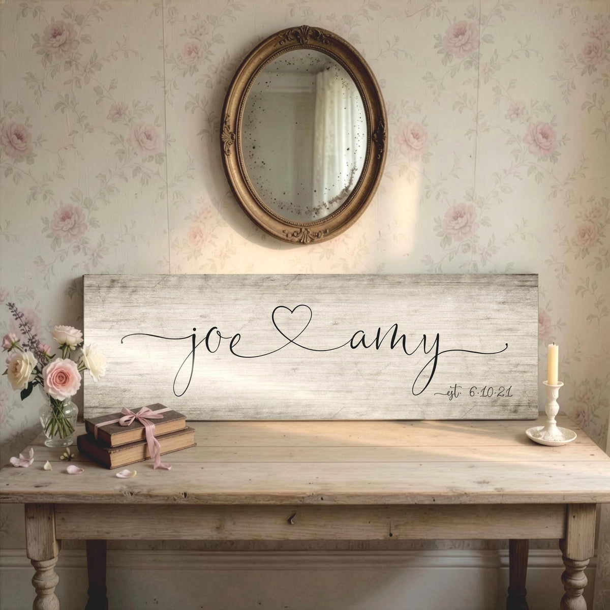 Rustic chic personalized sign on wood features the names Joe and Amy in a whimsical calligraphy with a heart connecting the names. The established date is inscribed on the bottom corner, indicating their wedding date.