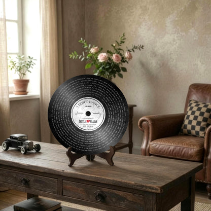 Round Record Plaque with names, song lyrics, and established date sits on easel on wooden desk.