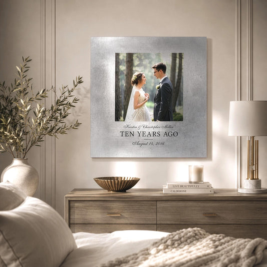Tin and aluminum Metal portrait art with the phrase "Ten Years Ago" under a wedding portrait on a tarnished metal plaque. It hangs above a dresser in a modern luxury bedroom.